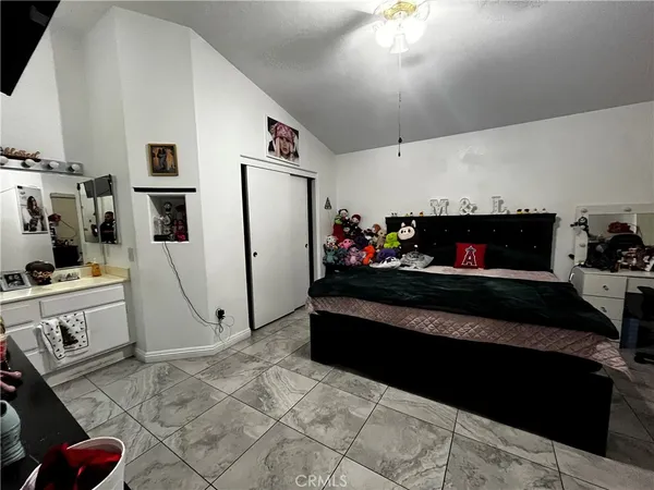 a living room with furniture fireplace and flat screen tv