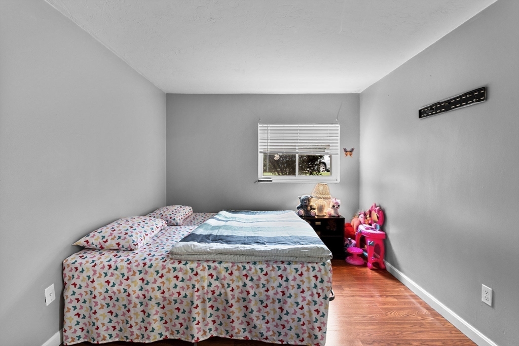 11 Gibbs Street, Unit C40 Worcester, MA 01607 - Photo 11 of 21 a bedroom with a bed dresser and window