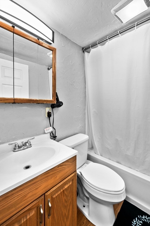 11 Gibbs Street, Unit C40 Worcester, MA 01607 - Photo 13 of 21 a bathroom with a sink a toilet and shower