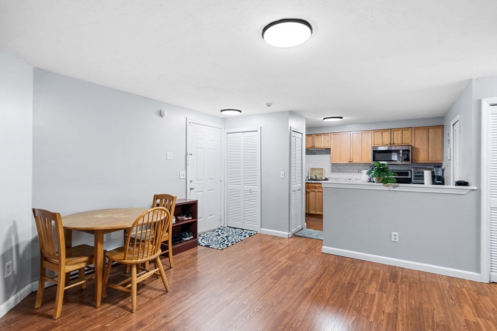 11 Gibbs Street, Unit C40 Worcester, MA 01607 - Photo 15 of 21 a room with stainless steel appliances kitchen island granite countertop a dining table chairs and granite counter tops
