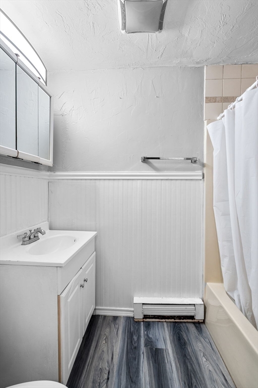 11 Gibbs Street, Unit C40 Worcester, MA 01607 - Photo 17 of 21 a bathroom with a sink a mirror and a shower