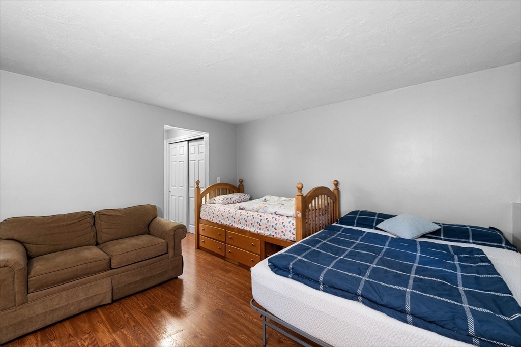 11 Gibbs Street, Unit C40 Worcester, MA 01607 - Photo 4 of 21 a bedroom with furniture and a window