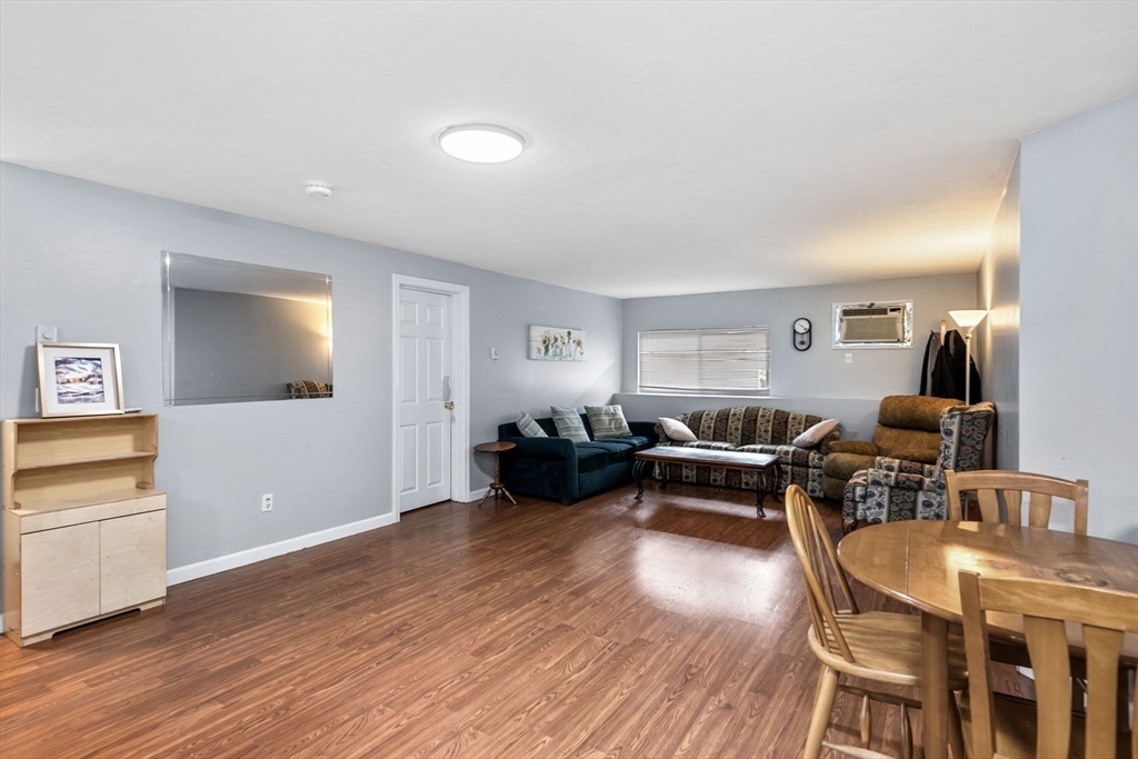 11 Gibbs Street, Unit C40 Worcester, MA 01607 - Photo 5 of 21 a living room with furniture and a wooden floor