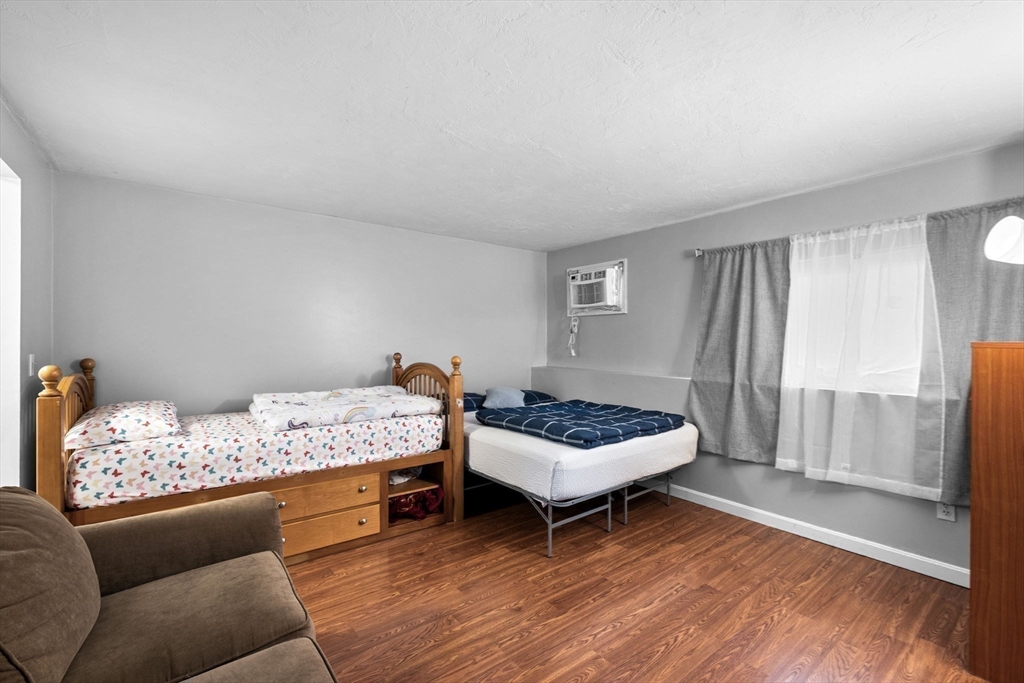 11 Gibbs Street, Unit C40 Worcester, MA 01607 - Photo 7 of 21 a bedroom with a bed and a couch