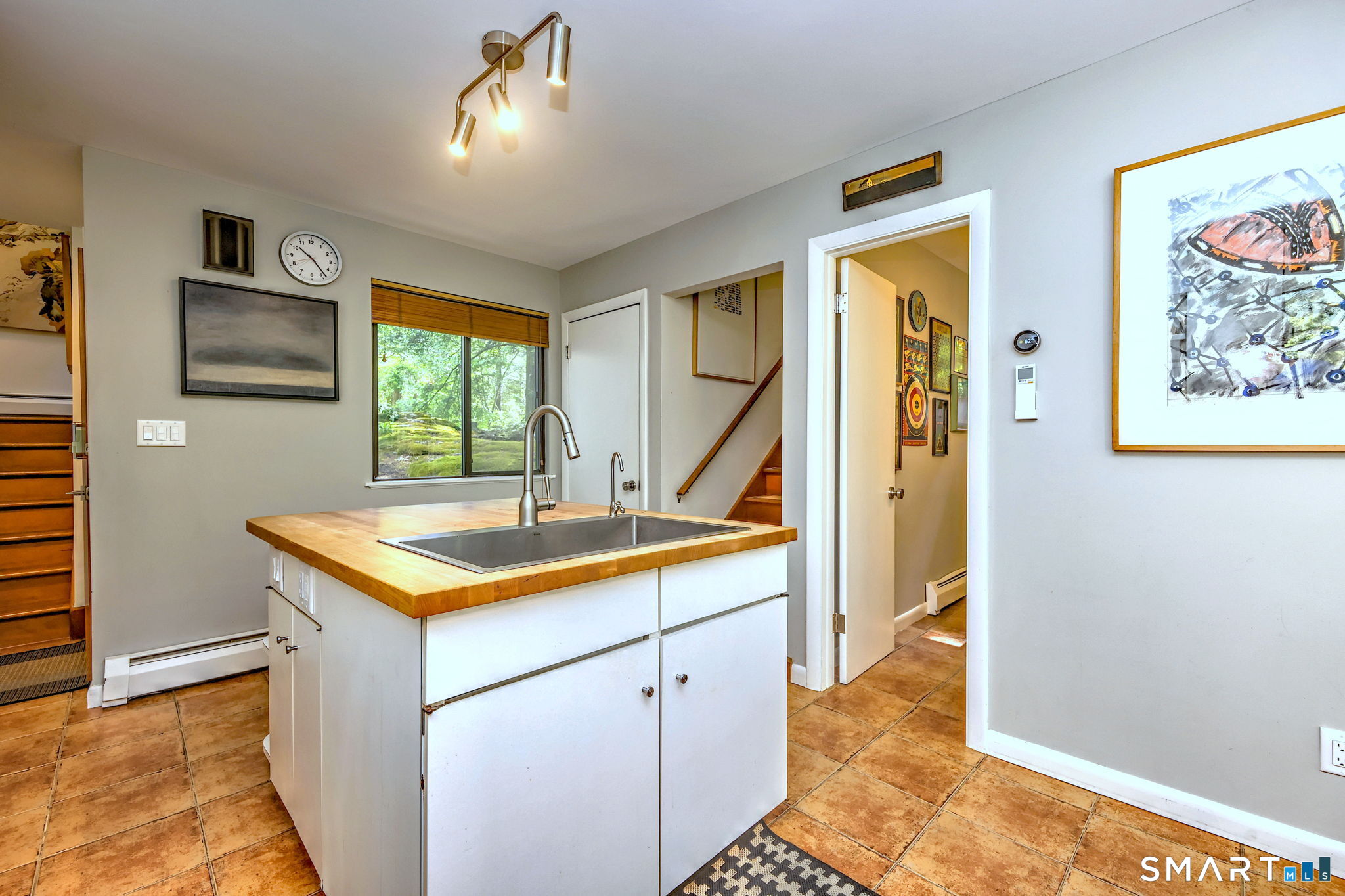95 Thankful Stow Road Guilford, CT 06437 - Photo 15 of 40 Kitchen includes butcher block topped island. A convenient second staircase directly to the primary bedroom!