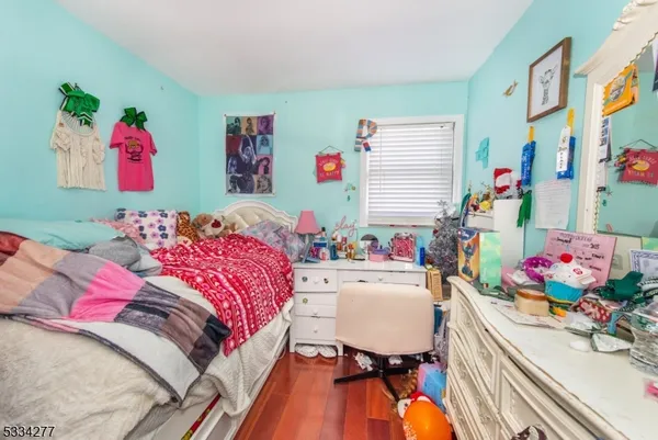 a bedroom with bed and window