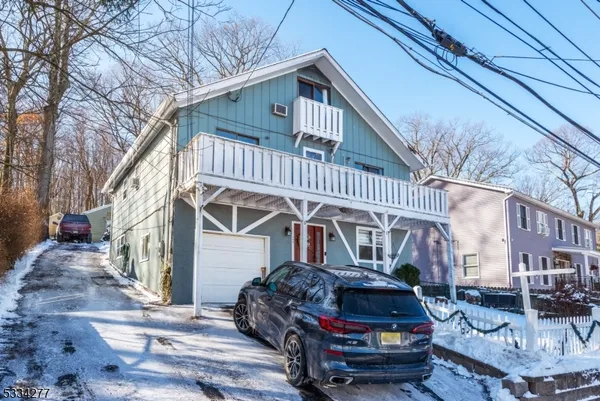 a car parked in front of a house