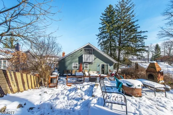 a view of a patio with furniture and a yard
