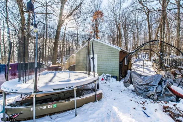 a view of a street with wooden fence
