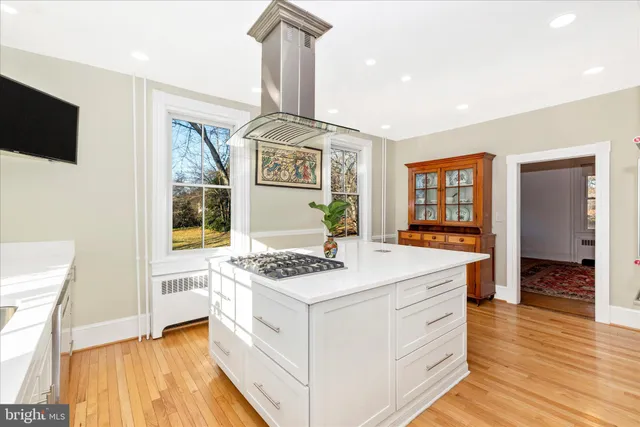 a kitchen with stainless steel appliances granite countertop a sink and a stove