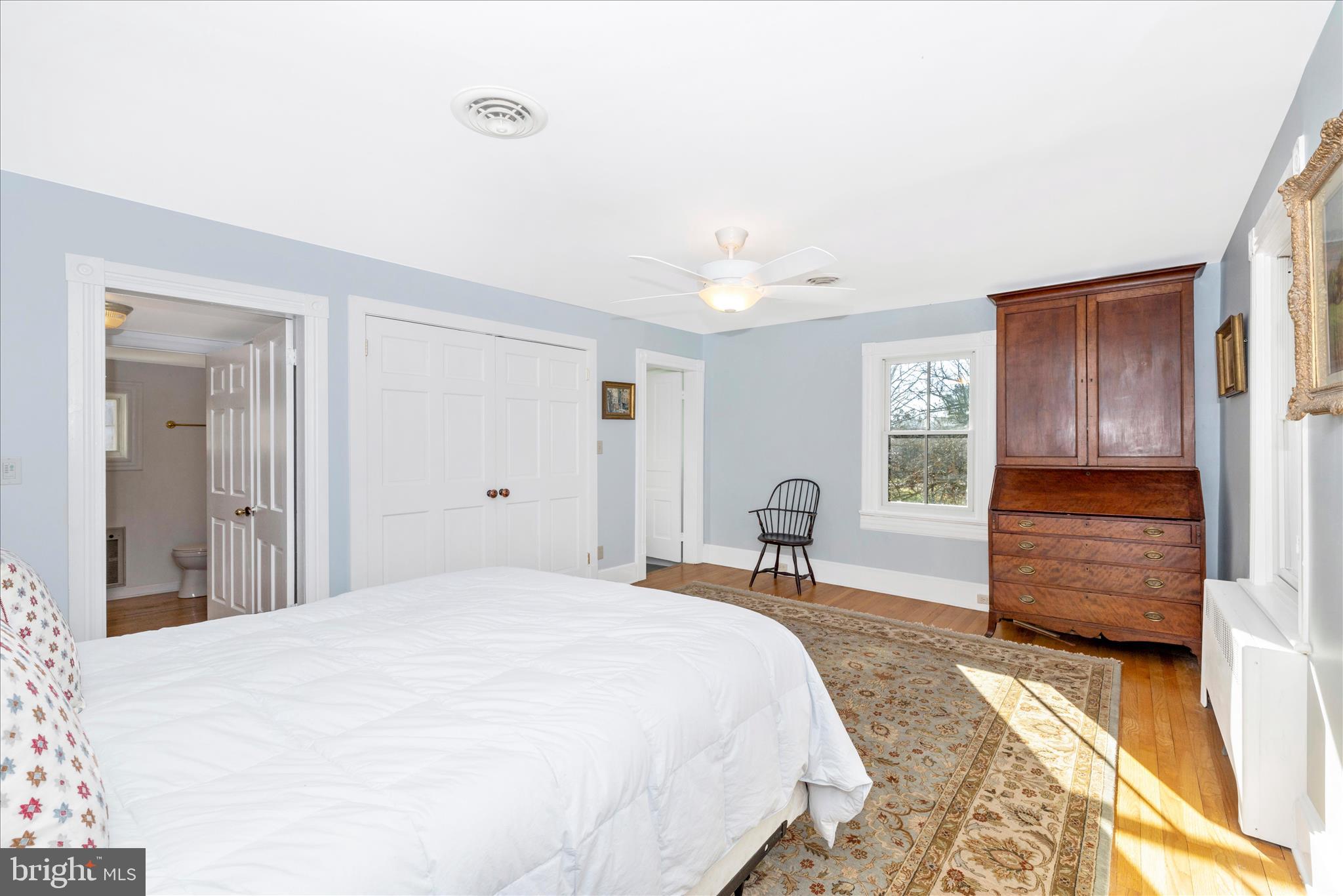 22170 Dickerson School Road Dickerson, MD 20842 - Photo 21 of 64 a bedroom with a bed and wooden floor