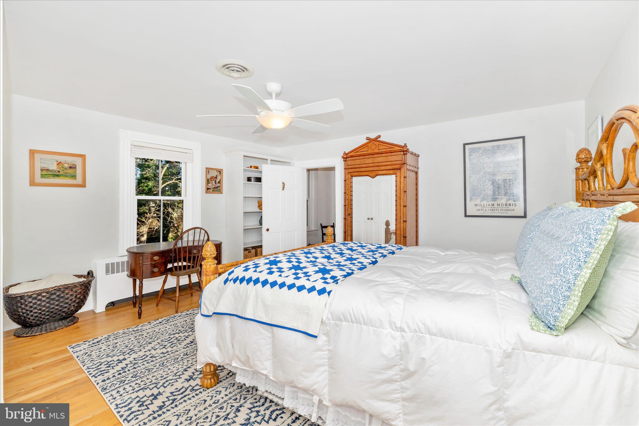 22170 Dickerson School Road Dickerson, MD 20842 - Photo 29 of 64 a bedroom with a bed and wooden floor