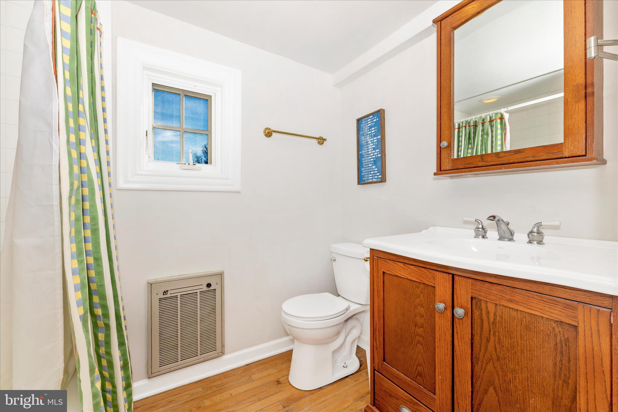 22170 Dickerson School Road Dickerson, MD 20842 - Photo 34 of 64 a bathroom with a toilet sink and mirror