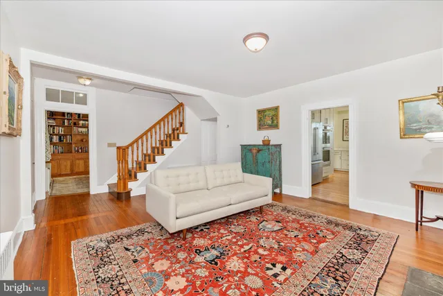 a living room with furniture and a rug