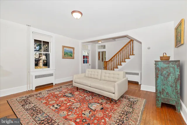 a living room with furniture and a rug
