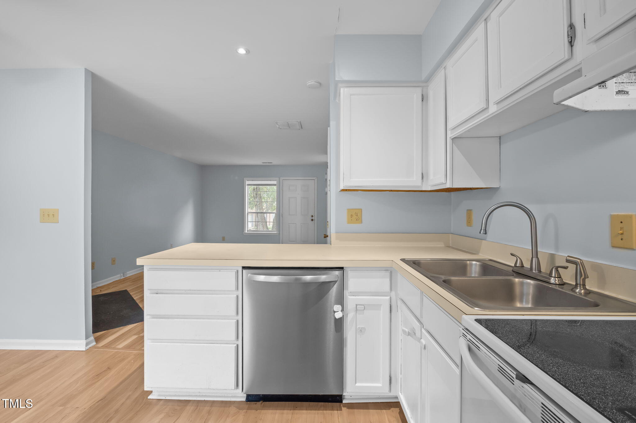 115 Coleridge Court Carrboro, NC 27510 - Photo 14 of 33 a kitchen with stainless steel appliances granite countertop a sink stove and cabinets