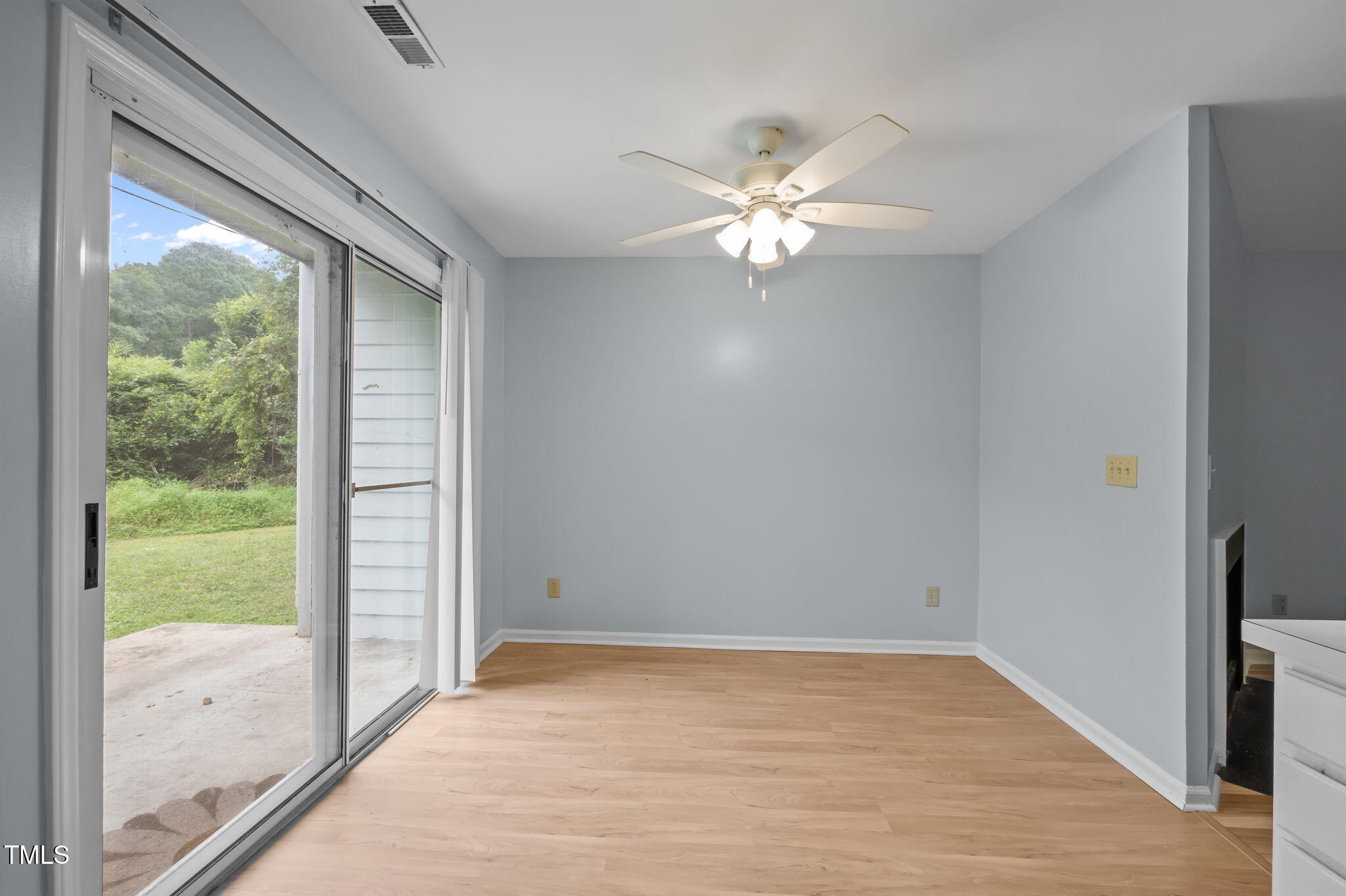 115 Coleridge Court Carrboro, NC 27510 - Photo 15 of 33 a view of empty room with wooden floor and fan