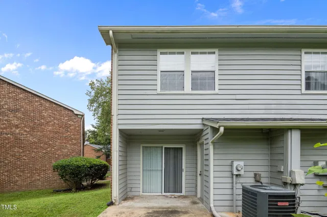 an aerial view of house with yard ocean and mountain view