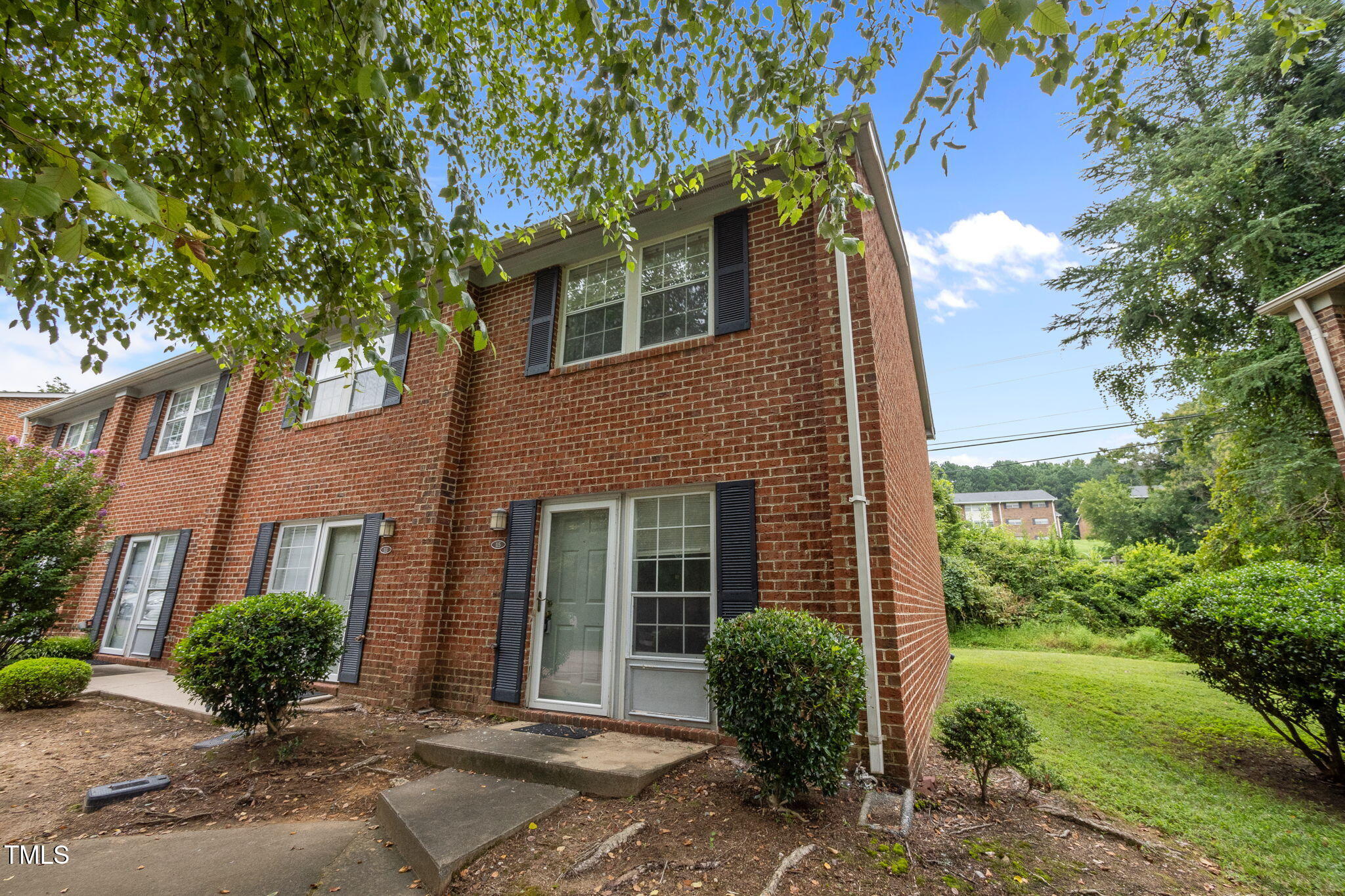 115 Coleridge Court Carrboro, NC 27510 - Photo 3 of 33 a view of a house with a garden