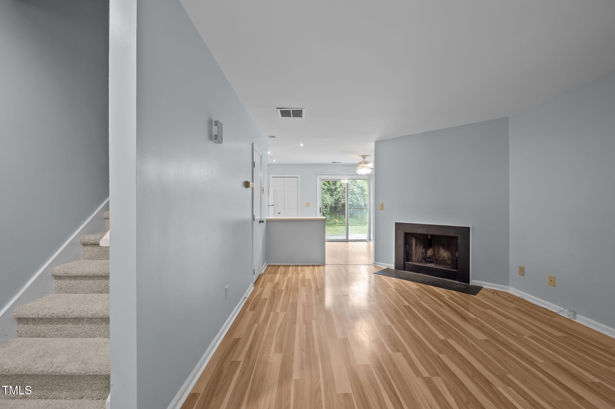 115 Coleridge Court Carrboro, NC 27510 - Photo 7 of 33 a view of a livingroom with wooden floor and a fireplace