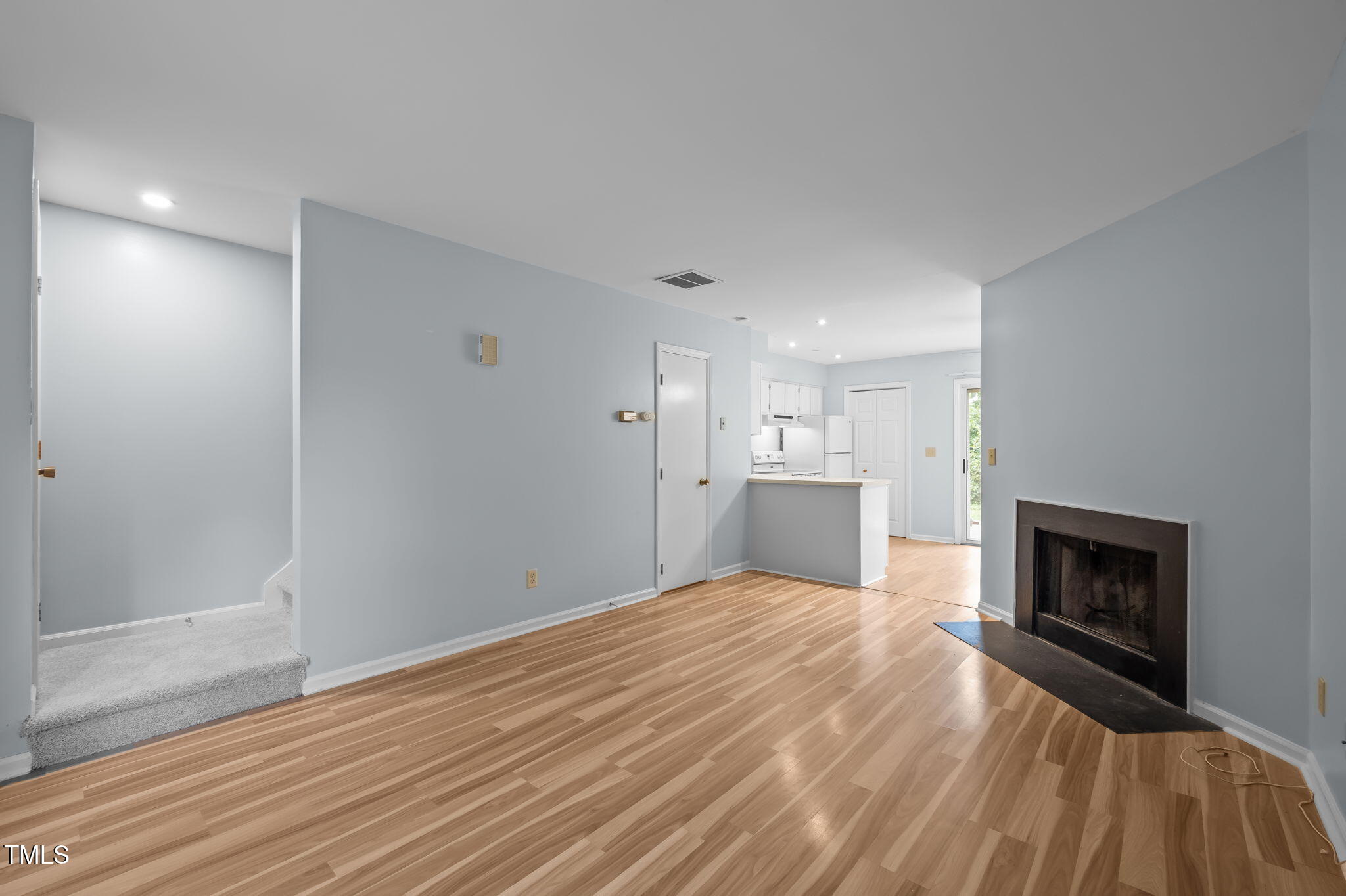 115 Coleridge Court Carrboro, NC 27510 - Photo 8 of 33 a view of a kitchen with a sink and a fireplace