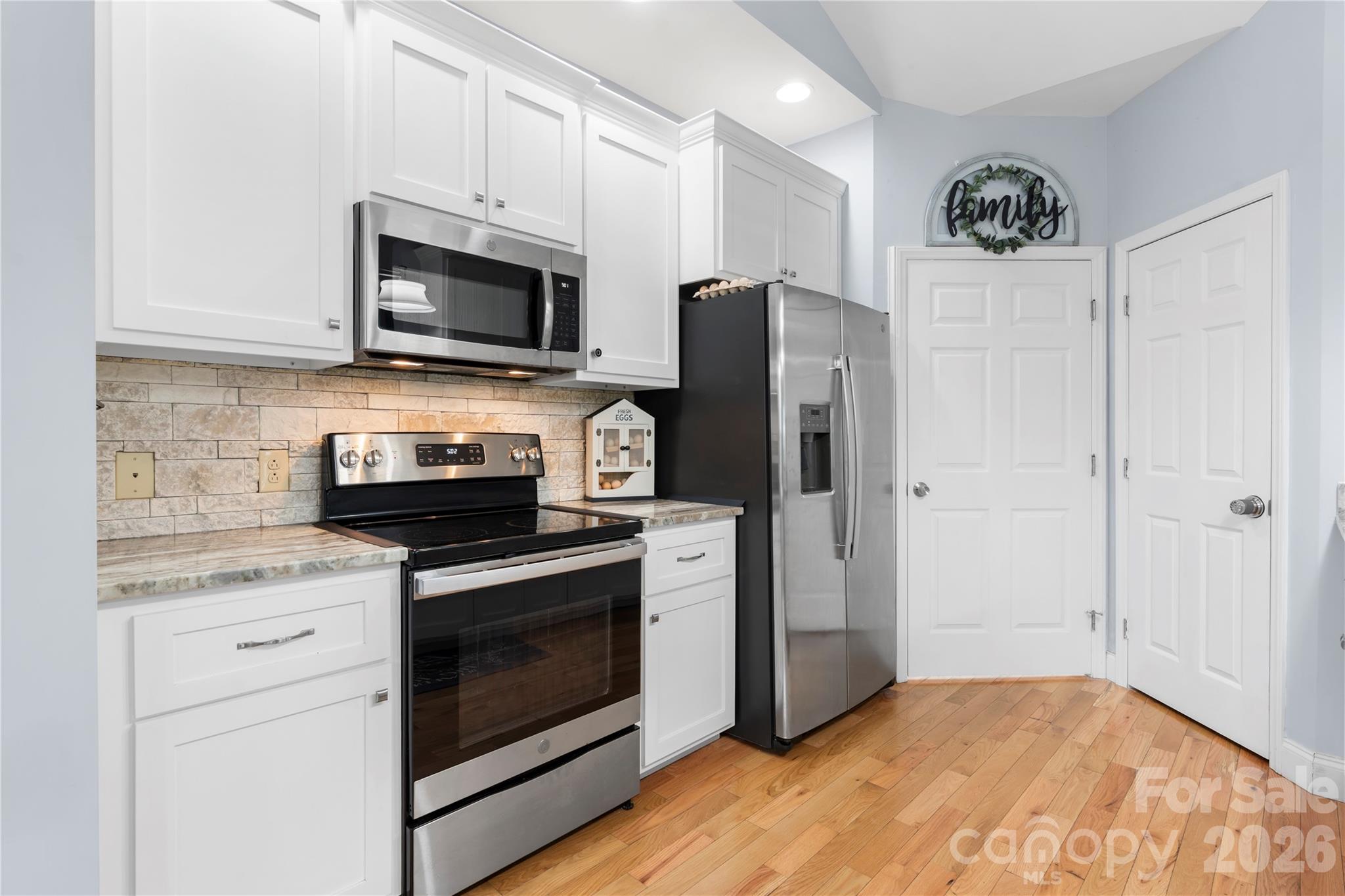 111 Pinewood Road Granite Falls, NC 28630 - Photo 10 of 33 a kitchen with stainless steel appliances granite countertop a refrigerator stove and microwave