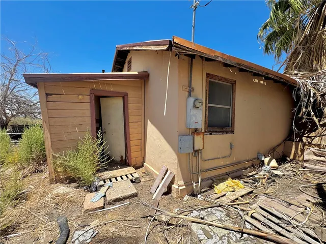 a view of a house with a snow in the yard