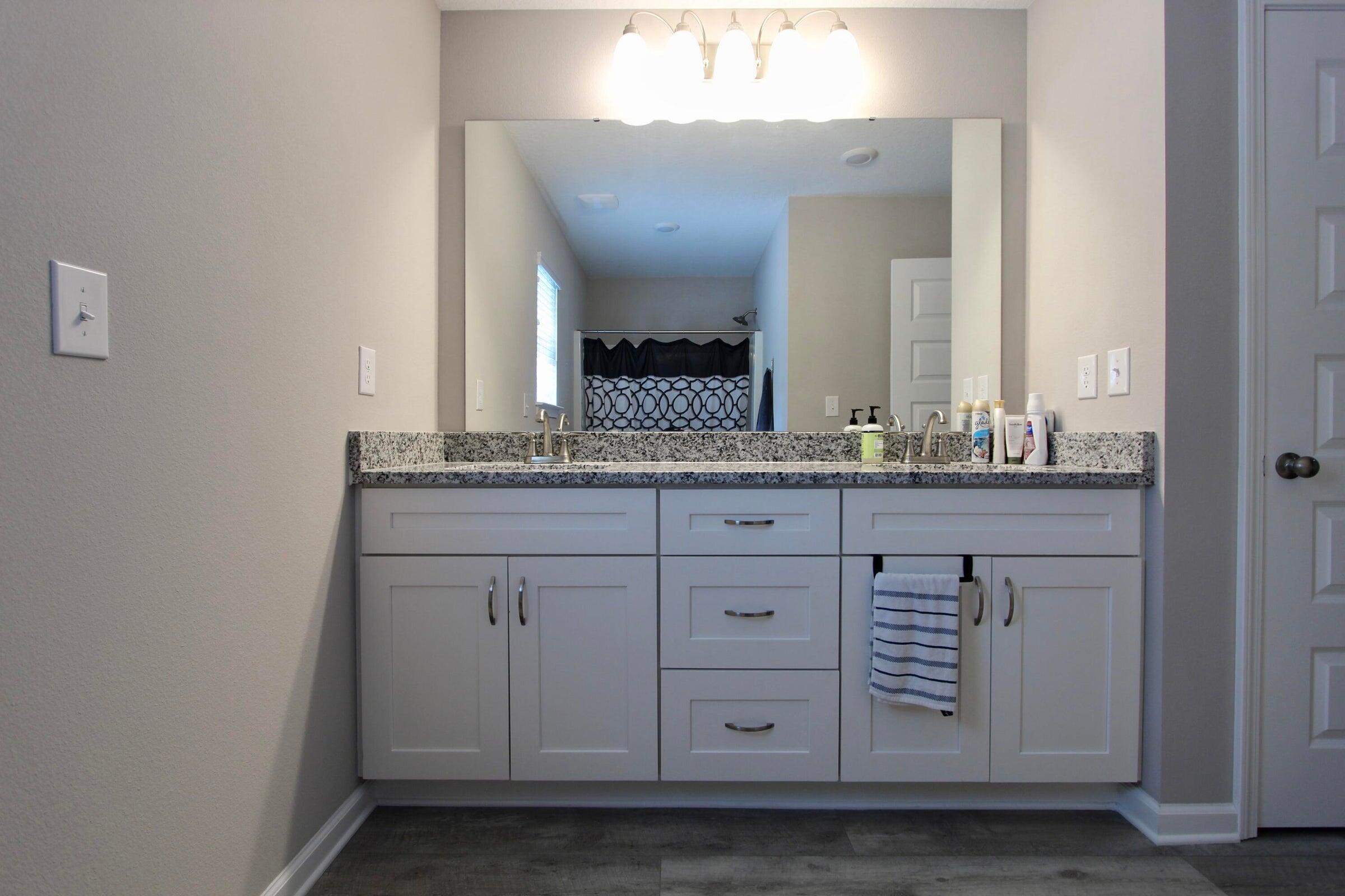 102 Windsor Drive Crestview, FL 32539 - Photo 20 of 25 a bathroom with a sink and a mirror
