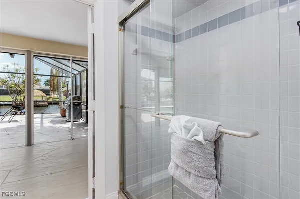 a bathroom with a glass shower door