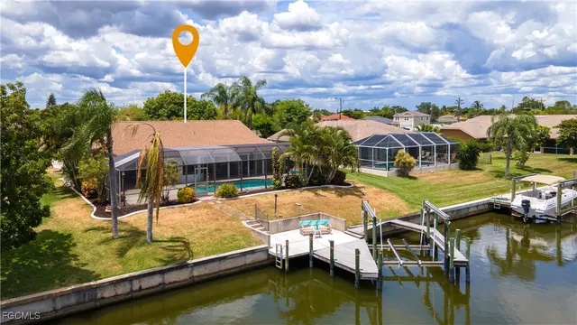 a swimming pool with outdoor seating and yard