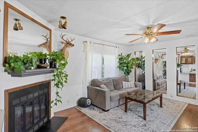 a living room with furniture and a fireplace