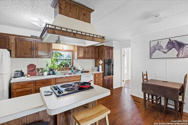 a kitchen with a table and chairs in it