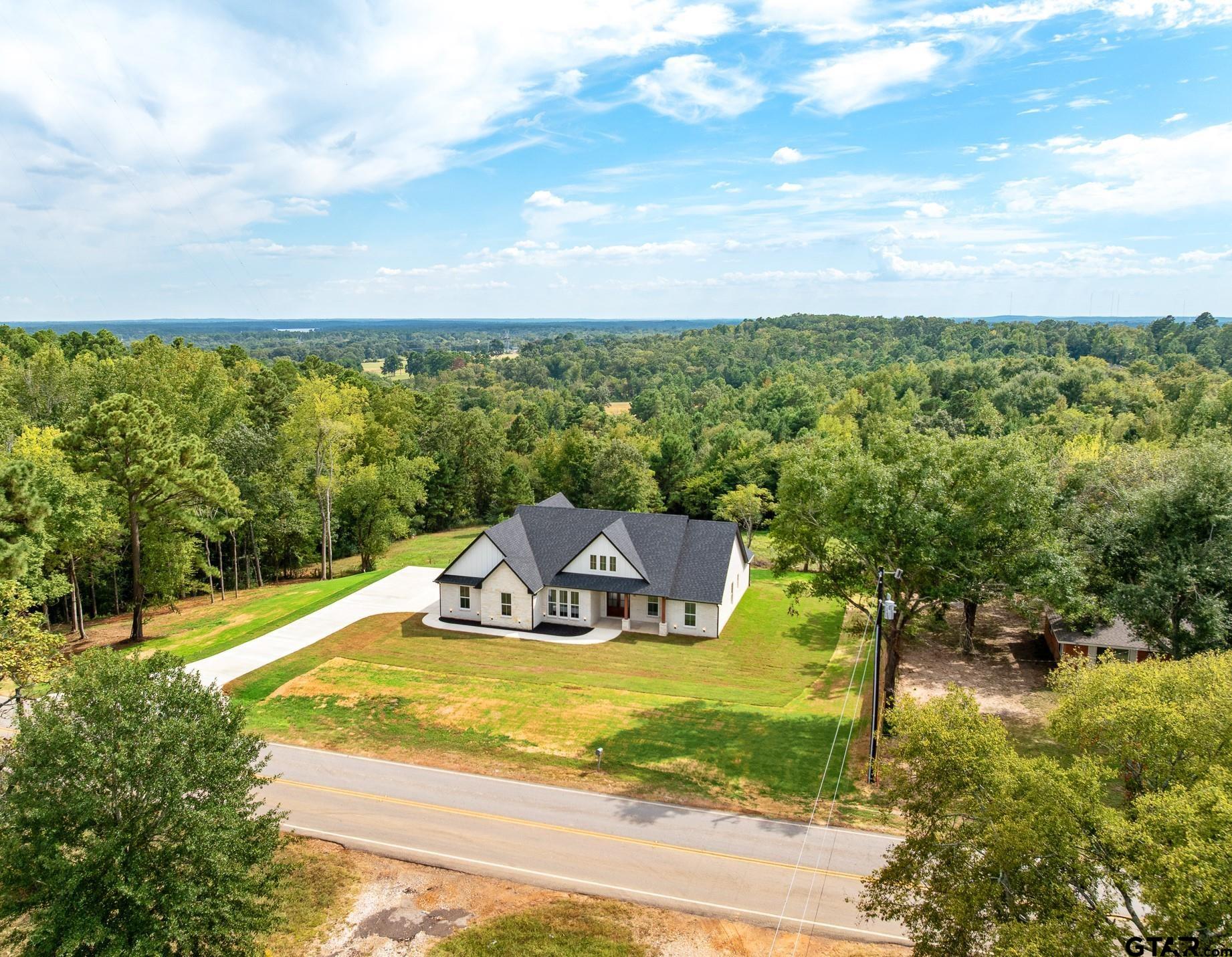 Gorgeous setting on .9 acre with amazing view