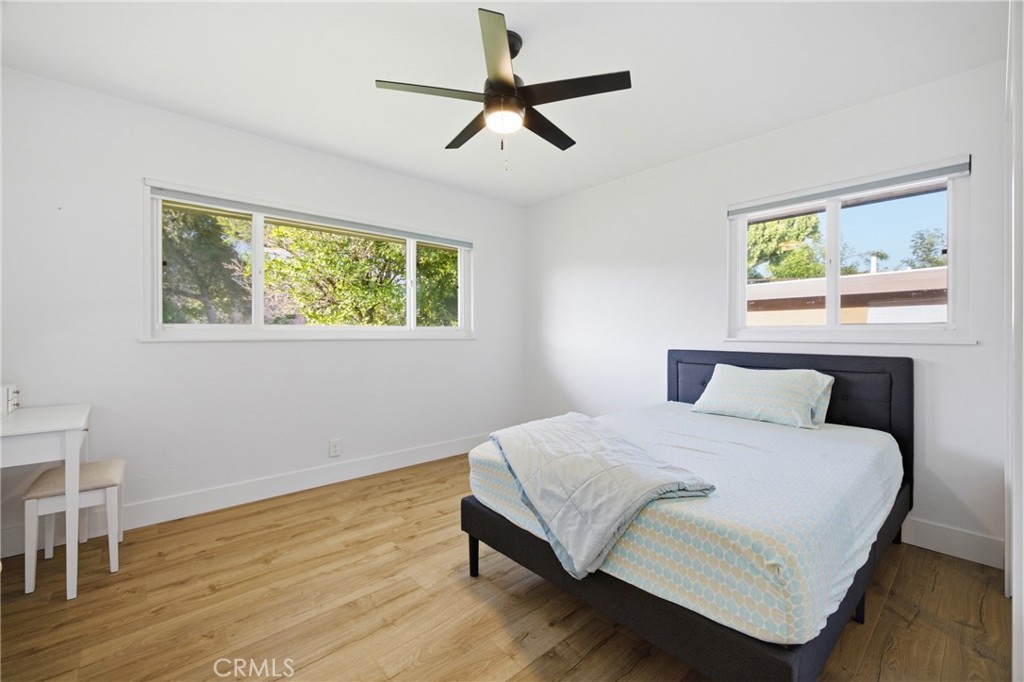 384 Colorado Street Arcadia, CA 91007 - Photo 42 of 51 a bedroom with a bed paintings on the wall and a window