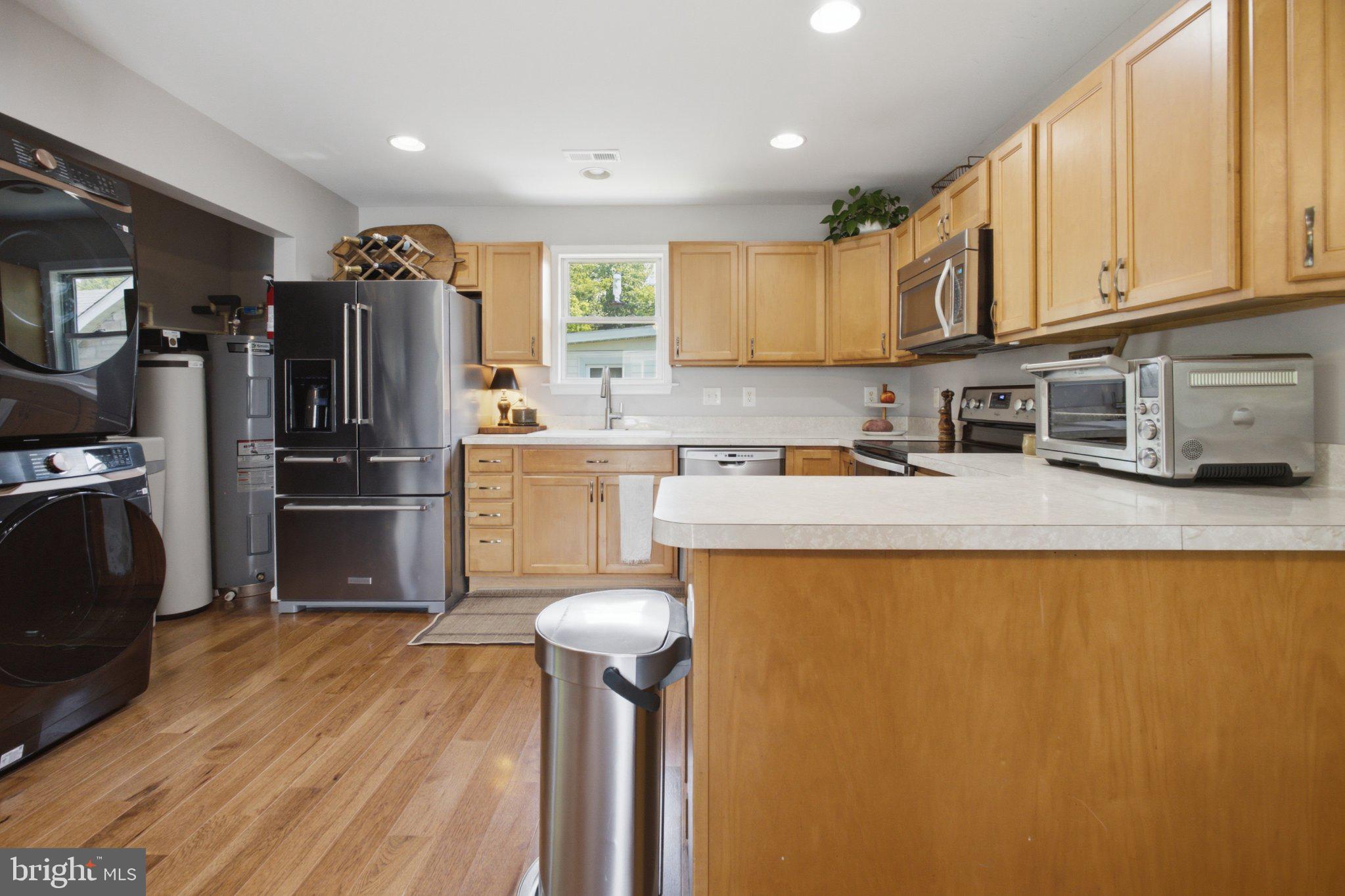 5650 Deale Churchton Road Churchton, MD 20733 - Photo 13 of 31 Modern kitchen with warm wood tones.