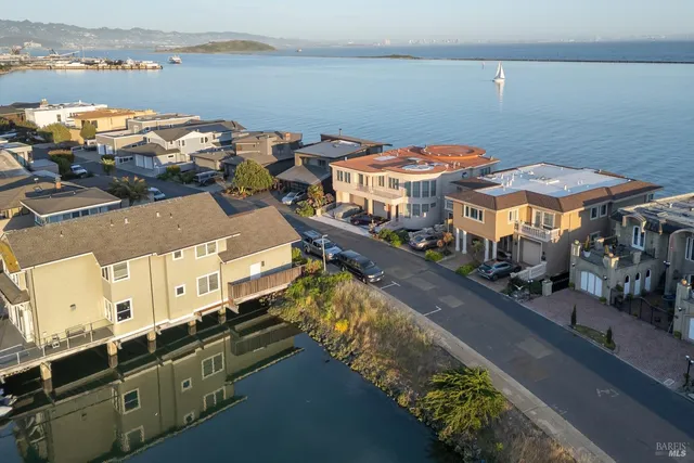 a view of a lake with a city skyline in the background