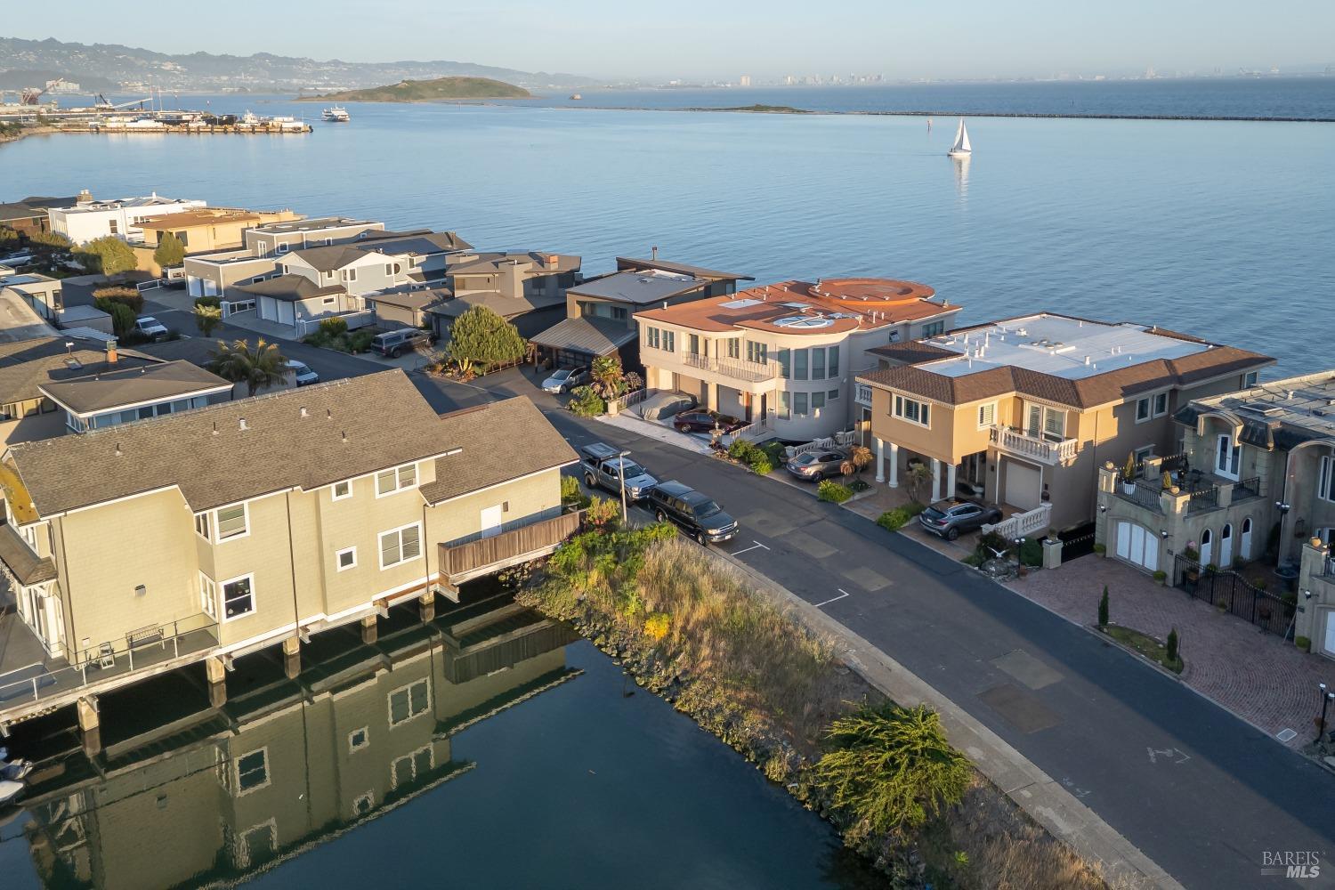0 Sand Piper Spit Richmond, CA 94801 - Photo 2 of 32 a view of a lake with a city skyline in the background