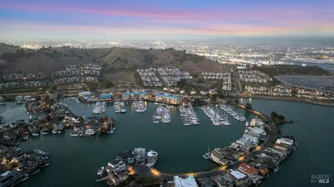 an aerial view of a houses with ocean view