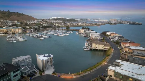 an aerial view of a residential houses with outdoor space