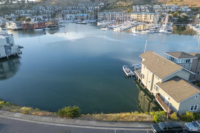 an aerial view of a house with a lake view