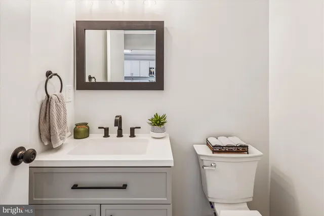 a bathroom with a sink toilet and a tub