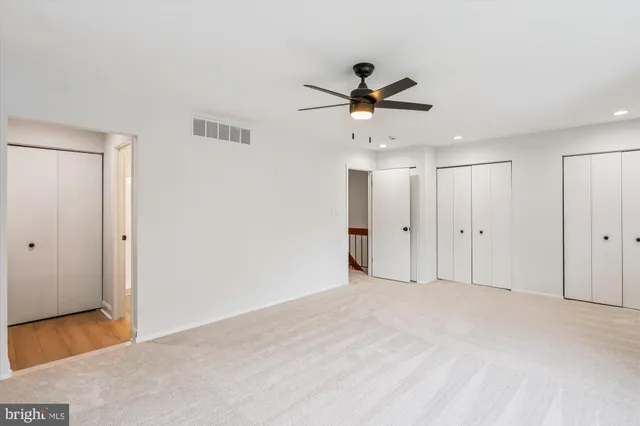 a backyard of a house with potted plants