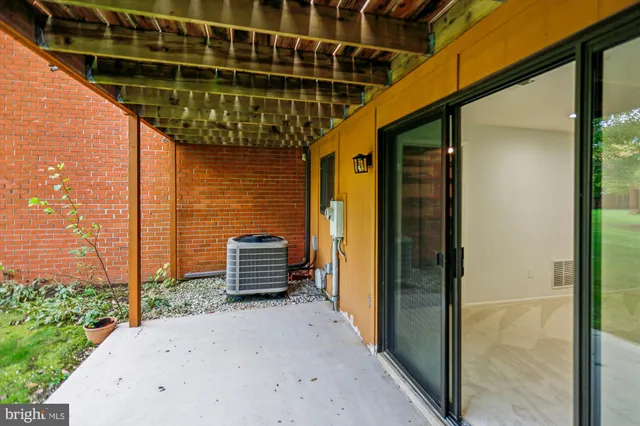 a view of an empty room with a staircase