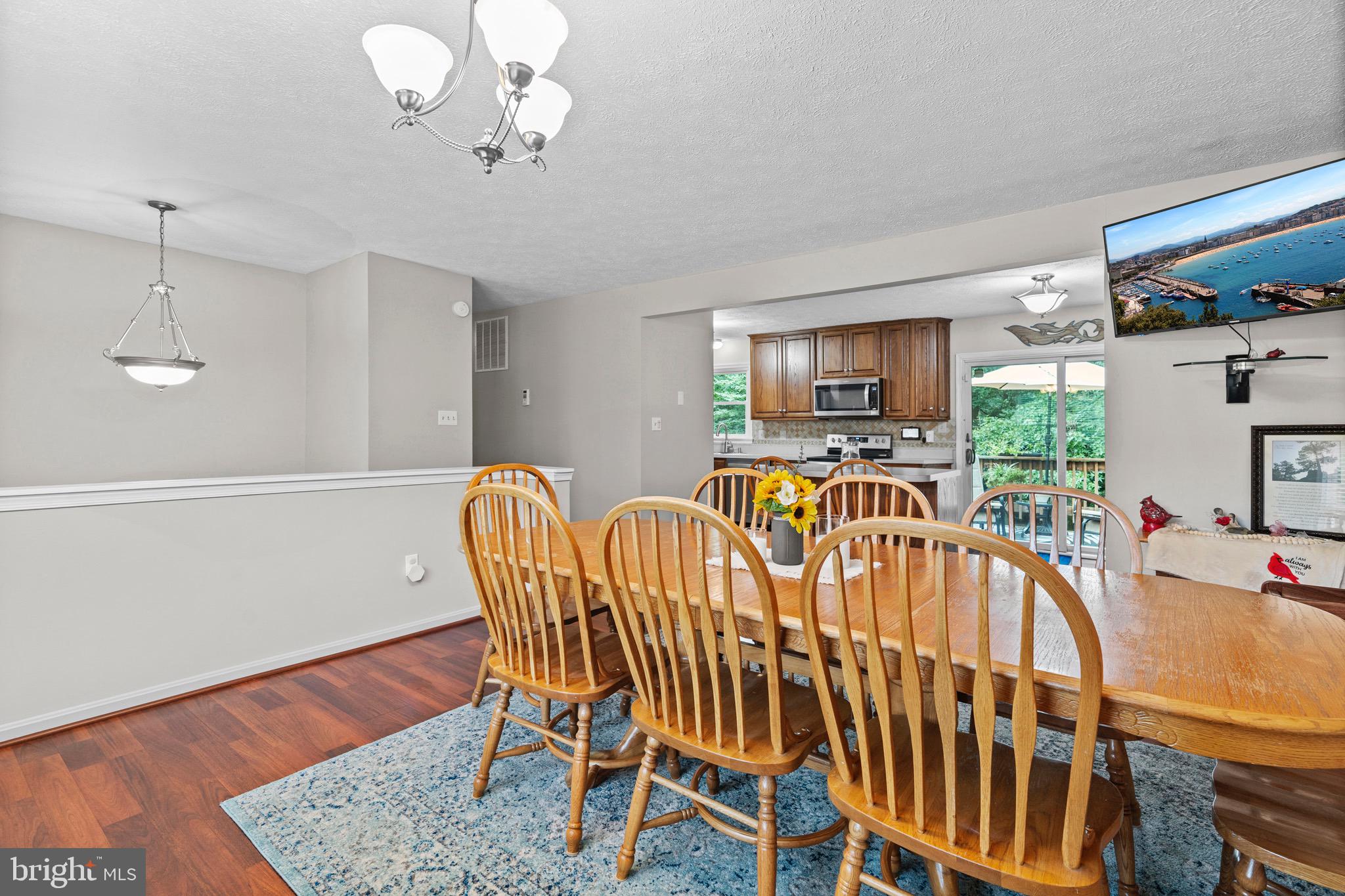 26599 Yowaiski Mill Road Mechanicsville, MD 20659 - Photo 15 of 58 a view of a dining room with furniture window and wooden floor
