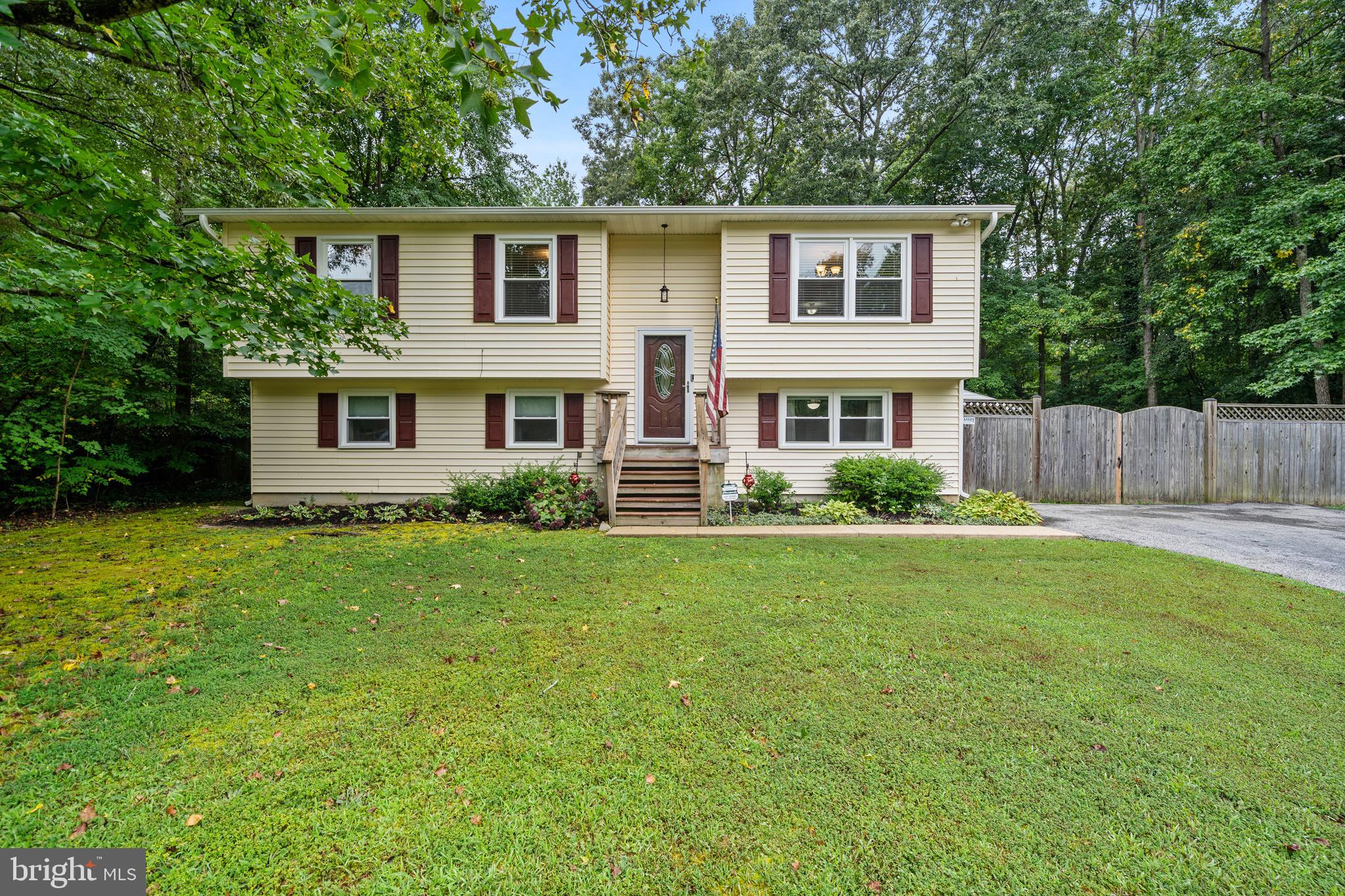 26599 Yowaiski Mill Road Mechanicsville, MD 20659 - Photo 2 of 58 front view of a house with a yard
