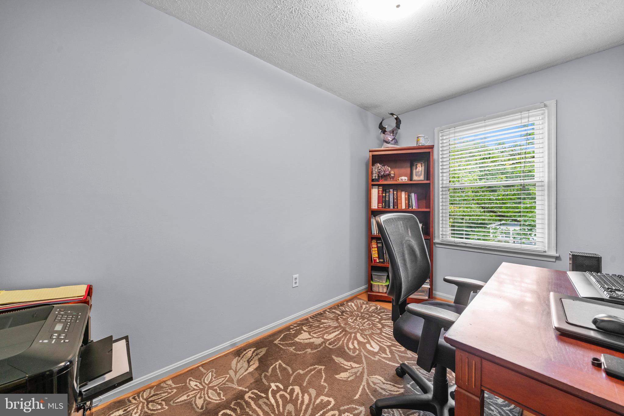 26599 Yowaiski Mill Road Mechanicsville, MD 20659 - Photo 30 of 58 a view of a workspace with furniture and a window