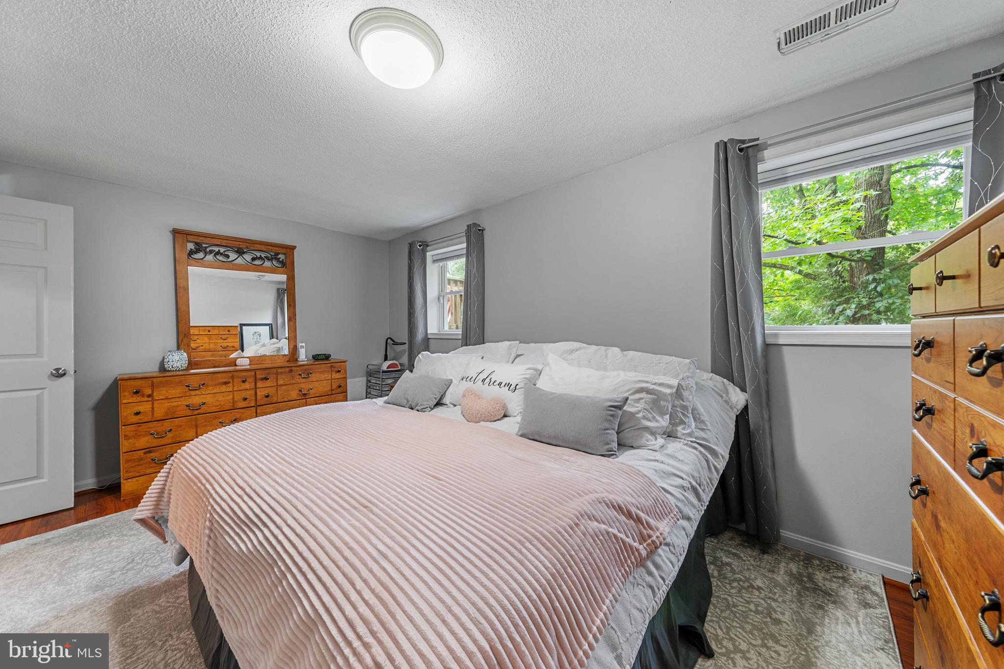 26599 Yowaiski Mill Road Mechanicsville, MD 20659 - Photo 33 of 58 a bedroom with a bed and a large window