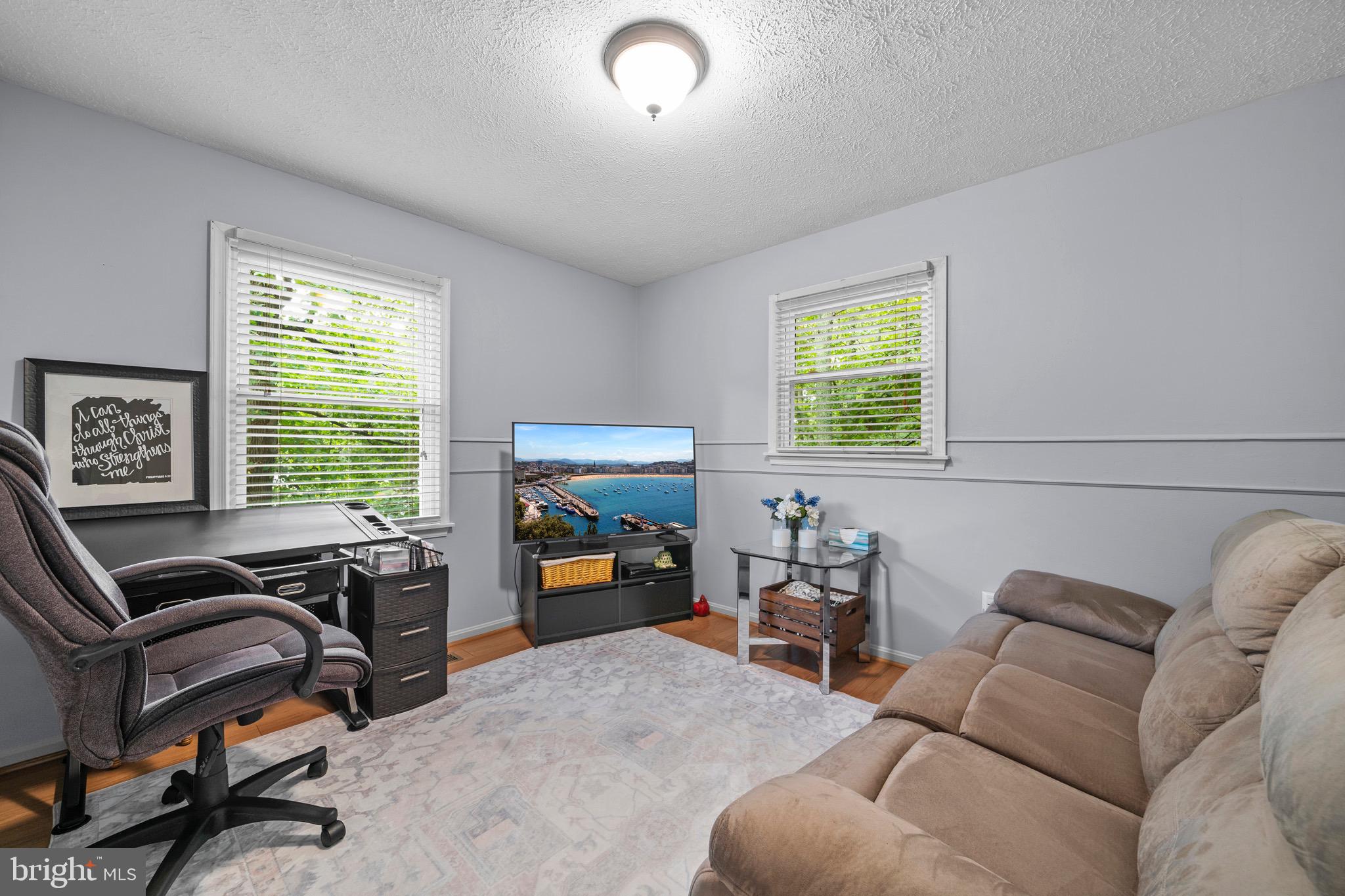 26599 Yowaiski Mill Road Mechanicsville, MD 20659 - Photo 37 of 58 a living room with furniture and a window