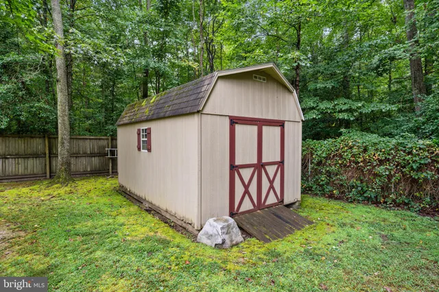 a view of a chair and table in the balcony