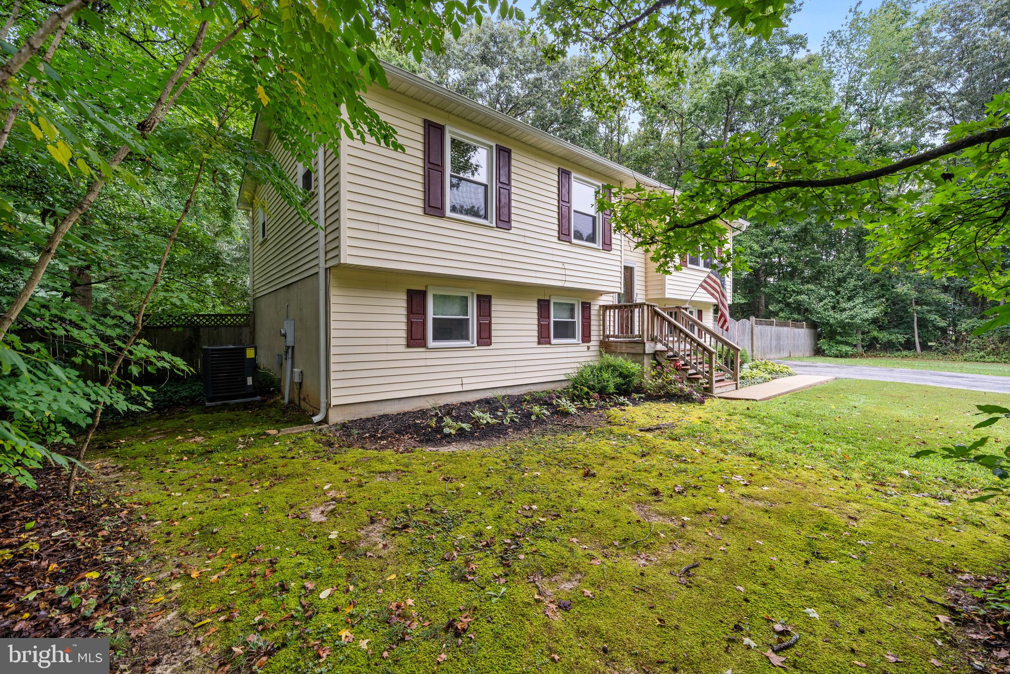 26599 Yowaiski Mill Road Mechanicsville, MD 20659 - Photo 6 of 58 a view of a house with a backyard